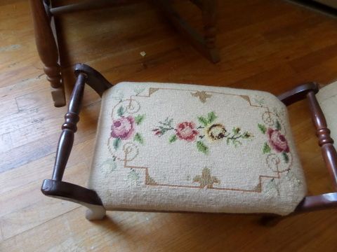 ANTIQUE OAK ROCKER CHAIR WITH UPHOLSTERED SEAT AND BACK. NEEDLE POINT FOOT STOOL,  LARGE RAG DOLL