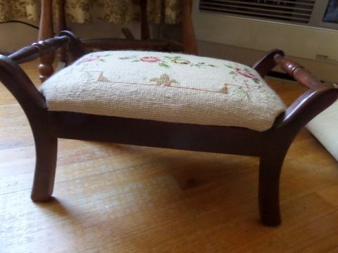 ANTIQUE OAK ROCKER CHAIR WITH UPHOLSTERED SEAT AND BACK. NEEDLE POINT FOOT STOOL,  LARGE RAG DOLL