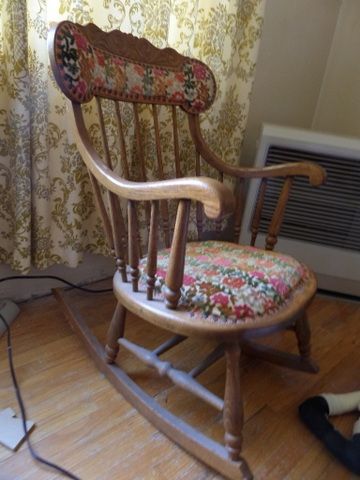 ANTIQUE OAK ROCKER CHAIR WITH UPHOLSTERED SEAT AND BACK. NEEDLE POINT FOOT STOOL,  LARGE RAG DOLL