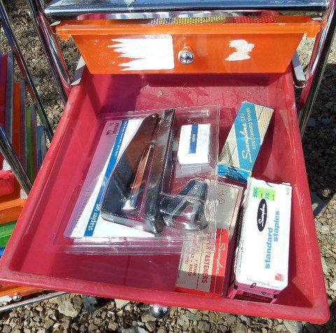 TWO BRIGHT COLORED STORAGE DRAWERS WITH OFFICE SUPPLIES