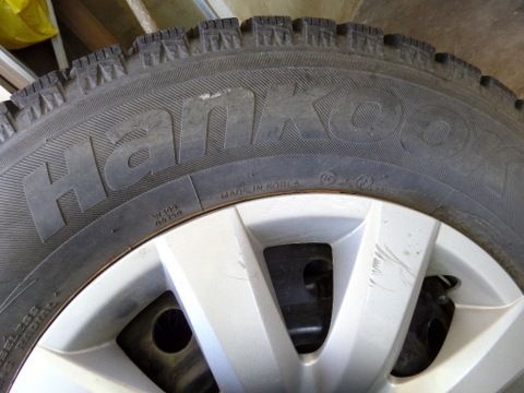 FOUR STUDDED SNOW TIRES MOUNTED ON WHEELS 205/70R15