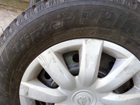 FOUR STUDDED SNOW TIRES MOUNTED ON WHEELS 205/70R15