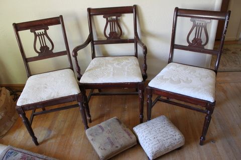 BEAUTIFUL AND STURDY ANTIQUE WOOD CHAIRS, MUSICAL EMBLEM BACK AND FOOT STOOLS