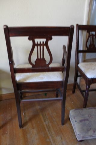 BEAUTIFUL AND STURDY ANTIQUE WOOD CHAIRS, MUSICAL EMBLEM BACK AND FOOT STOOLS