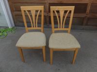 TWO SOLID WOODEN SIDE CHAIRS WITH UPHOLSTERED SEATS