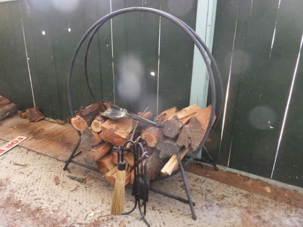 WROUGHT IRON ROUND FIREWOOD HOLDER, WITH FIRE TOOLS AND WOOD