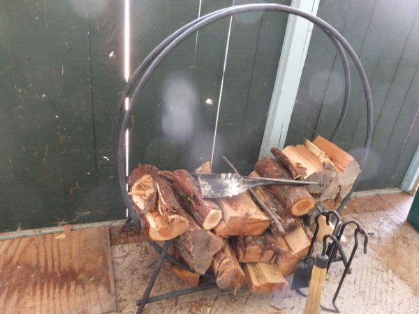 WROUGHT IRON ROUND FIREWOOD HOLDER, WITH FIRE TOOLS AND WOOD