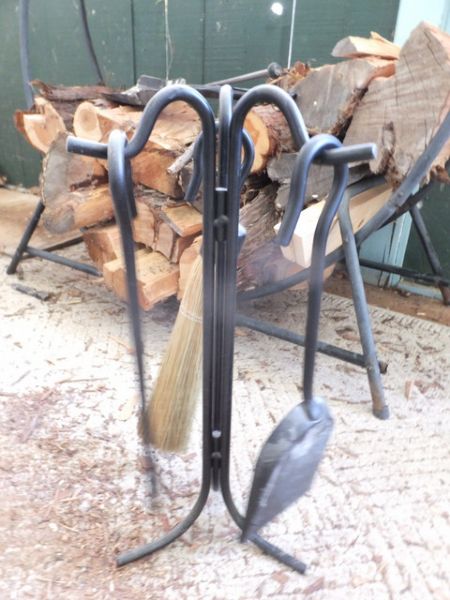 WROUGHT IRON ROUND FIREWOOD HOLDER, WITH FIRE TOOLS AND WOOD