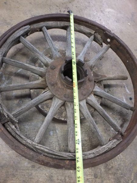 ANTIQUE TRUCK WHEEL WITH IRON RIM AND WOODEN SPOKES