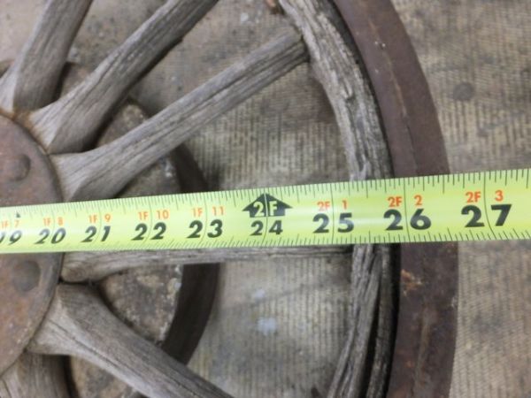 ANTIQUE TRUCK WHEEL WITH IRON RIM AND WOODEN SPOKES