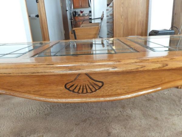OAK COFFEE TABLE WITH LEADED GLASS PANELS.