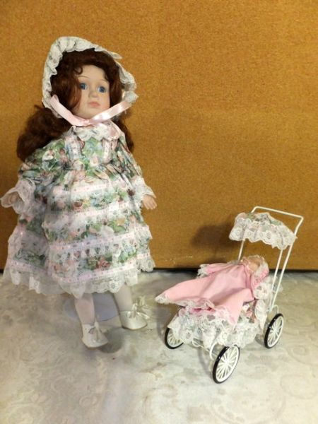 PRETTY  COLLECTIBLE  PORCELIAN/BISQUE DOLL WITH BABY IN PRAM