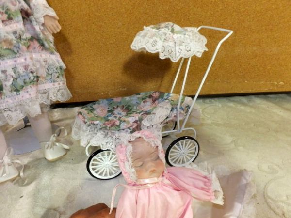 PRETTY  COLLECTIBLE  PORCELIAN/BISQUE DOLL WITH BABY IN PRAM