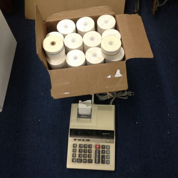 SHARP ADDING MACHINE & BOX OF TAPE ROLLS