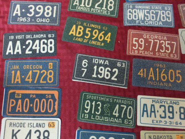 VERY INTERSTING COLLECTION OF VINTAGE LICENSE PLATE STICKERS 