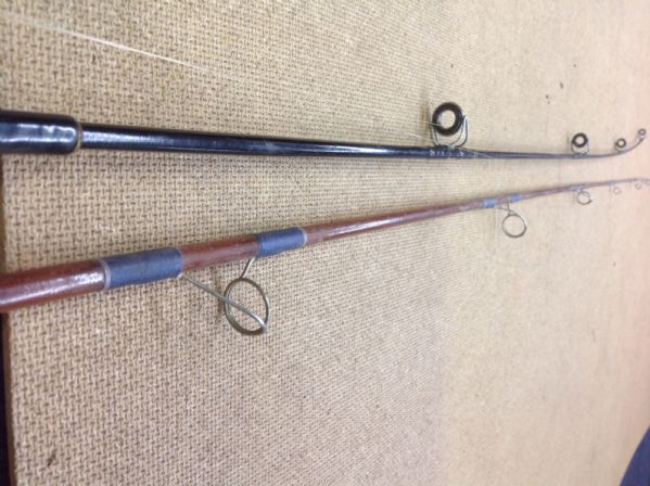 TWO FISHING POLES AND A REEL