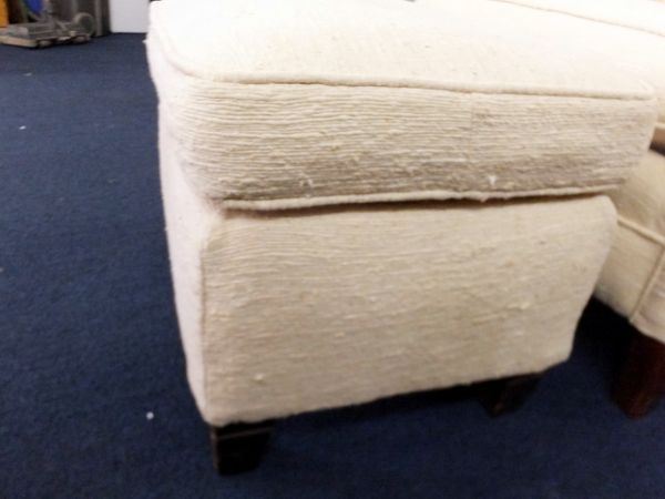 UPHOLSTERED OTTOMAN.