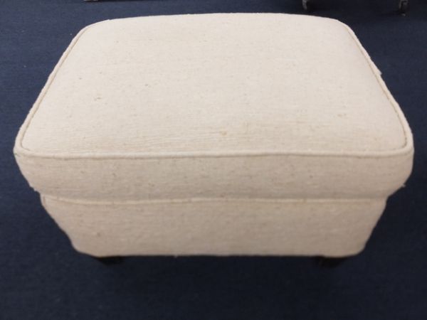 UPHOLSTERED OTTOMAN.