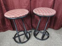 TWO METAL STOOLS WITH UPHOLSTERED TOPS