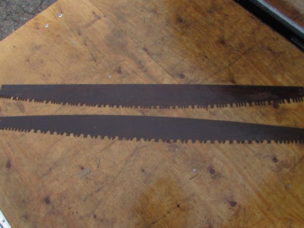 TWO  PRIMITIVE TWO MAN CROSSCUT SAW BLADES  WITH TWO HANDLES