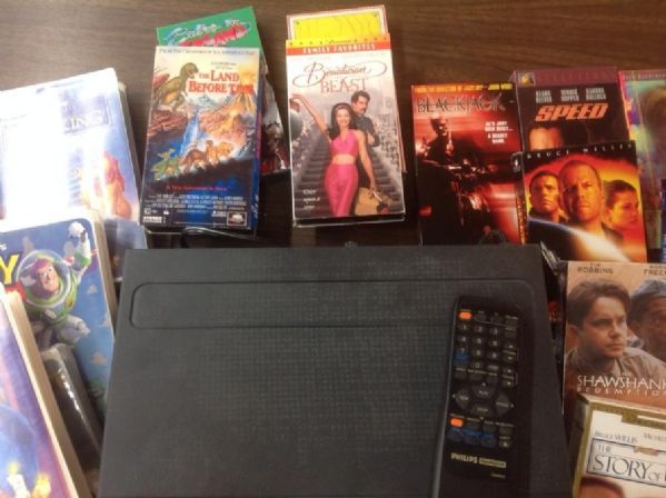 Lot Detail - PHILLIPS MAGNOVOX VHS PLAYER & REMOTE WITH 25 PLUS MOVIES