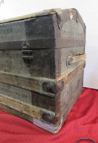 ANTIQUE HUMPBACK STEAMER TRUNK WITH STAMPED TIN EXTERIOR