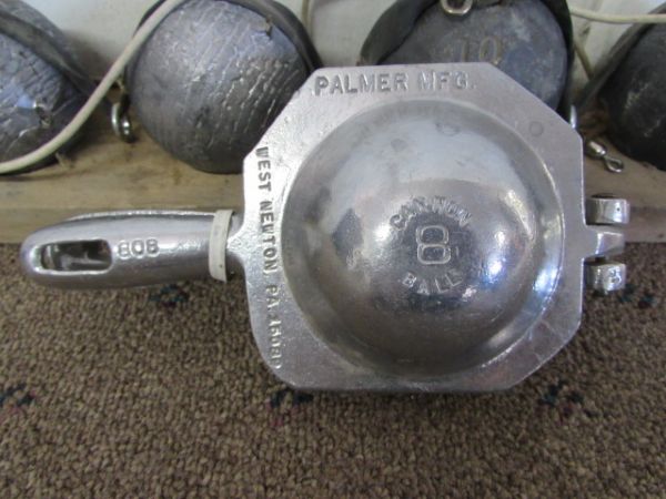 FIVE LEAD BALL WEIGHTS & A METAL FORM