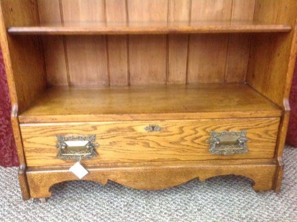 ANTIQUE OAK BOOKCASE WITH CARVED TOP, BEVELED MIRROR & DRAWER 