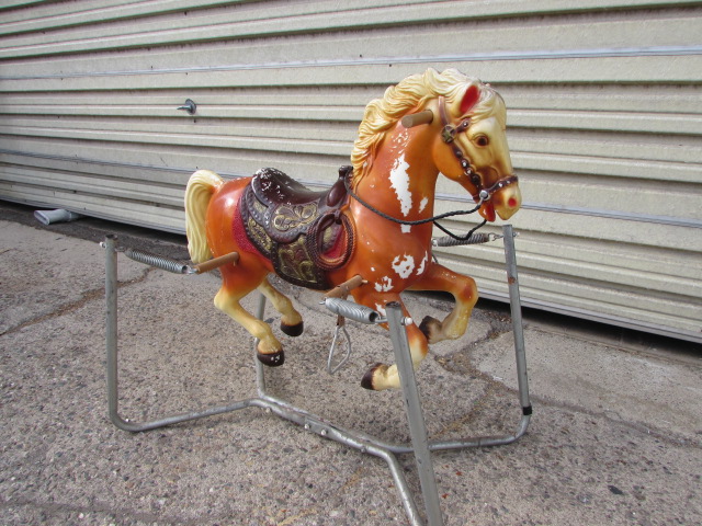 old plastic rocking horse