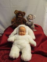 THREE ADORABLE COLLECTIBLE BABY DOLLS DRESSED IN FUN FUR!