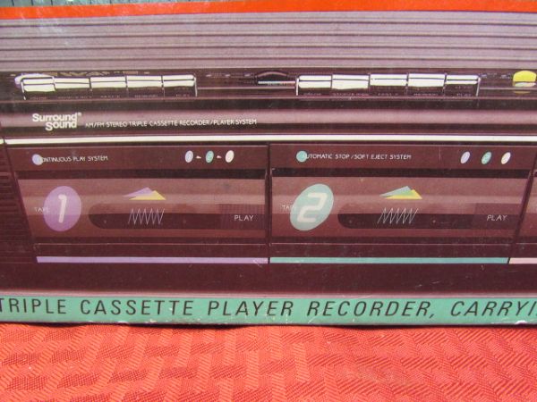 UNUSED IN THE ORIGINAL BOX NEWAVE RADIO/TRIPLE CASSETTE PLAYER