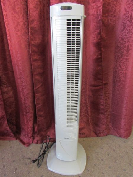 TWO OSCILLATING TOWER FANS