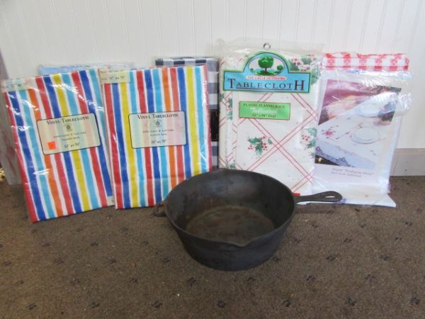 10 CAST IRON CHICKEN FRYER AND VINYL TABLECLOTHS 