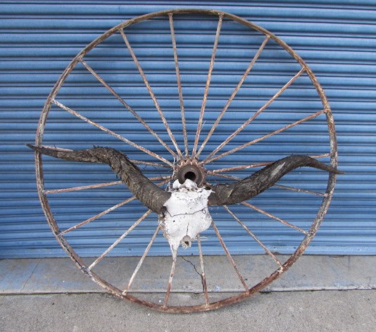 Lot Detail - COUNTRY YARD ART! RUSTIC ANTIQUE WAGON WHEEL WITH BULL SKULL