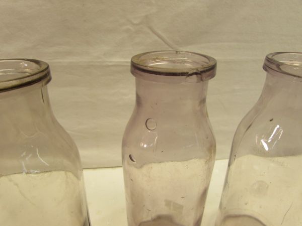 FOUR LOVELY ANTIQUE AMETHYST GLASS MILK BOTTLES