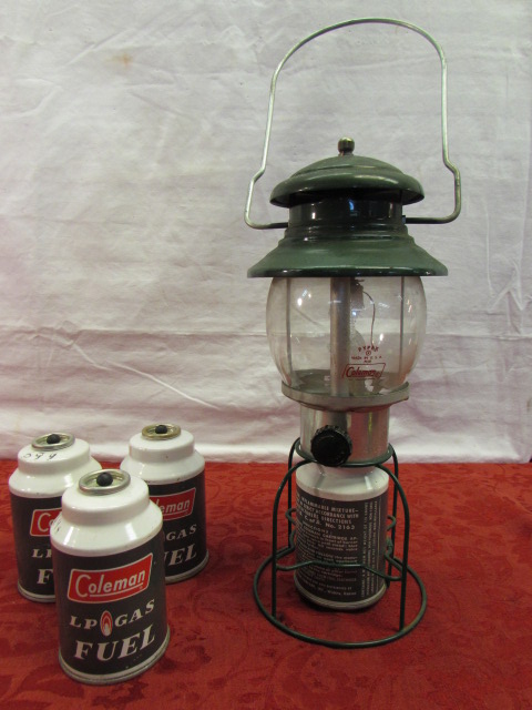 Lot Detail - VINTAGE COLEMAN LANTERN WITH PYREX GLOBE & 3 FUEL REFILLS