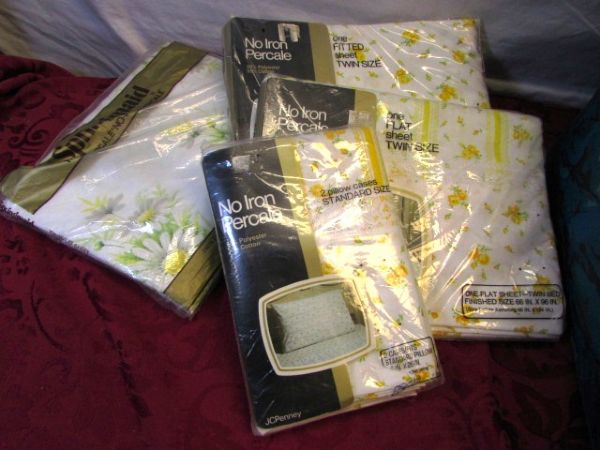 HUGE VARIETY OF NEVER USED SHEETS , 2 MATTRESS PADS & A CASE TO CARRY THEM HOME IN 