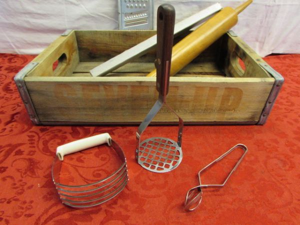 WOODEN 7 UP CRATE WITH VINTAGE UTENSILS - EKCO MIXER, ALUMINUM DONUT COOKING MOLDS & . . . . 