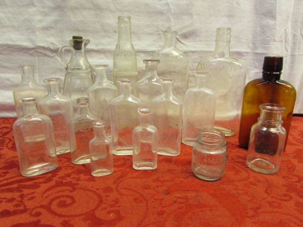 OVER A DOZEN ANTIQUE GLASS BOTTLES-WATHEN DISTILLERS, LYDIA E. PINKHAM, VASELINE & MORE