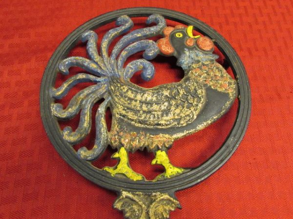 TWO VINTAGE CAST IRON ROOSTER TRIVETS & TWO WONDERFUL FRAMED PIECES  OF ART