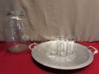 LARGE CLEAR GLASS  PICKLE JUG, ENGRAVED HAMMERED ALUMINUM TRAY & DRINKING GLASSES