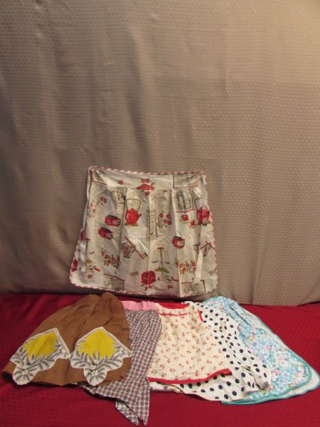 CLASSY COOK!  SIX FABULOUS VINTAGE APRONS. . .YOU WILL WANT TO WEAR THEM OUTSIDE THE KITCHEN TOO!