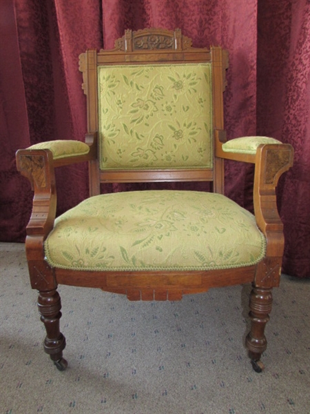 ANTIQUE UPHOLSTERED CARVED WOOD ARM CHAIR