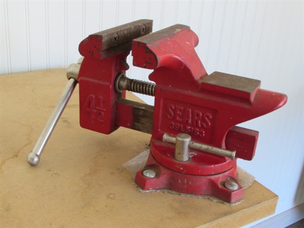 STURDY WORK STATION WITH LOTS OF STORAGE SPACE & A SWIVEL BASE BENCH VISE