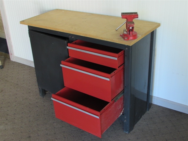 STURDY WORK STATION WITH LOTS OF STORAGE SPACE & A SWIVEL BASE BENCH VISE