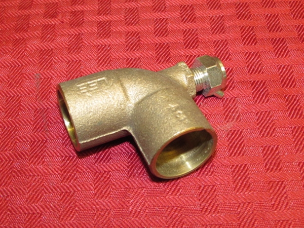 THREE BRASS VALVES & A FITTING OVER 4 LBS. OF BRASS