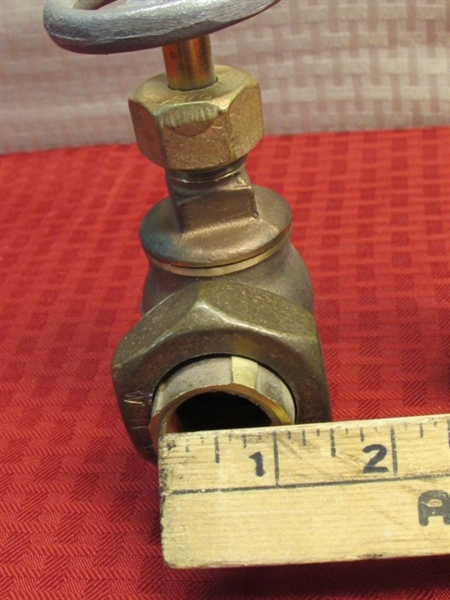 THREE BRASS VALVES & A FITTING OVER 4 LBS. OF BRASS