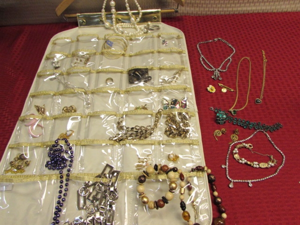 A PIRATE'S BOOTY OF VINTAGE COSTUME JEWELRY WITH HANGING DISPLAY STORAGE