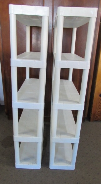 A PAIR OF WHITE PLASTIC SHELVING UNITS TO KEEP YOUR STUFF TIDY