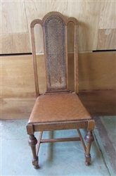 ANTIQUE WOOD CHAIR WITH CANED BACK & LEATHER SEAT